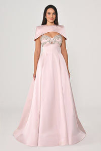 Pink evening gown with embellished top on a white background