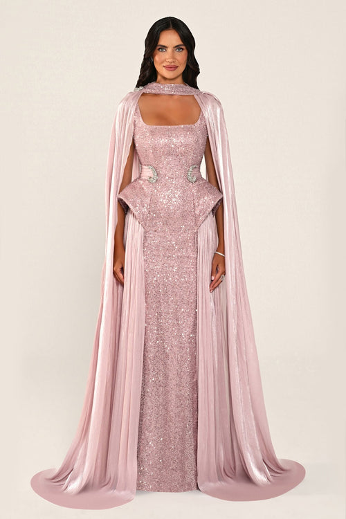 Celestara Dress in Baby Pink: sequin column gown with a square neckline, peplum hip detail, stone-embellished waist and a flowing organza cape