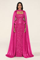 Celestara Dress in Fuscia: sequin column gown with a square neckline, peplum hip detail, stone-embellished waist and a flowing organza cape