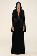 Noctavia Dress in Black: velvet gown with padded shoulders, a plunging satin-trimmed V-neck, long split cape sleeves and a satin knot at the waist