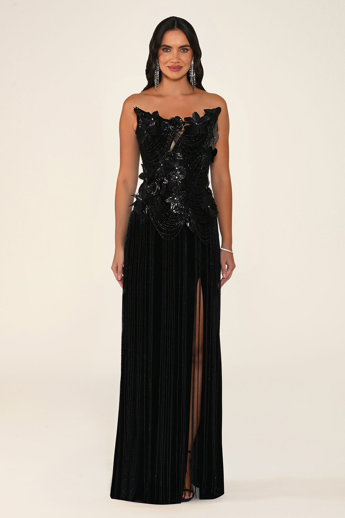 Noirelle strapless black velvet maxi evening dress with sequinned 3D petal corset bodice and leg slit