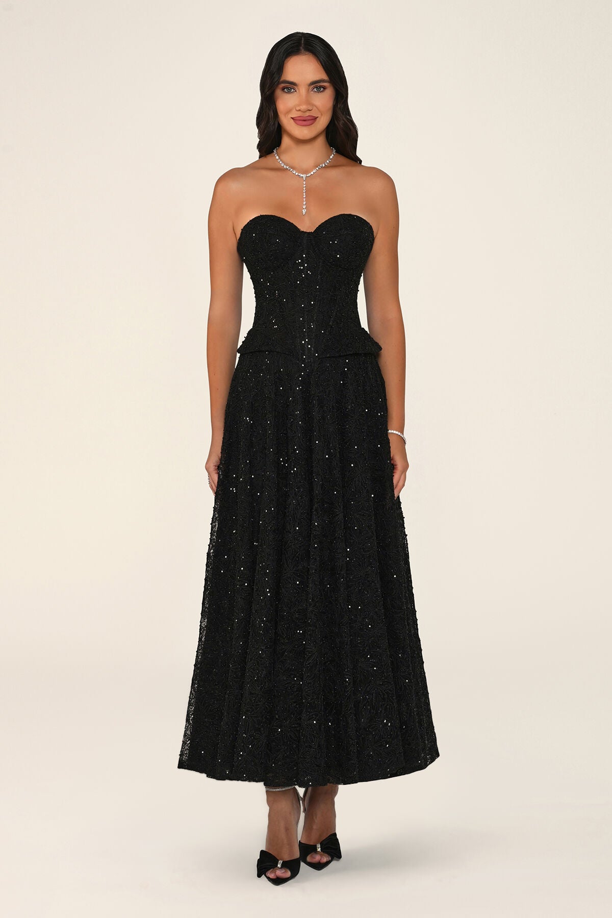 Clarisse dress in black worn strapless without the bolero