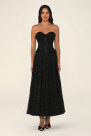 Clarisse dress in black worn strapless without the bolero