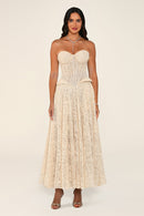 Clarisse dress in beige worn strapless without the bolero