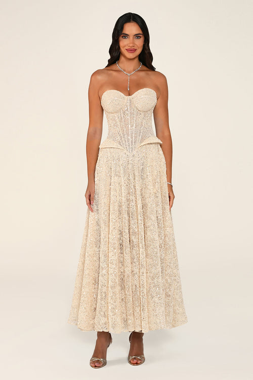 Clarisse dress in beige worn strapless without the bolero